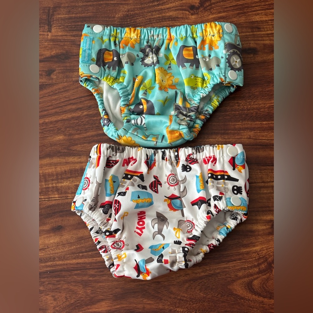 Two Charlie Banana reusable boys swim diaper in size large (20-27 lb).